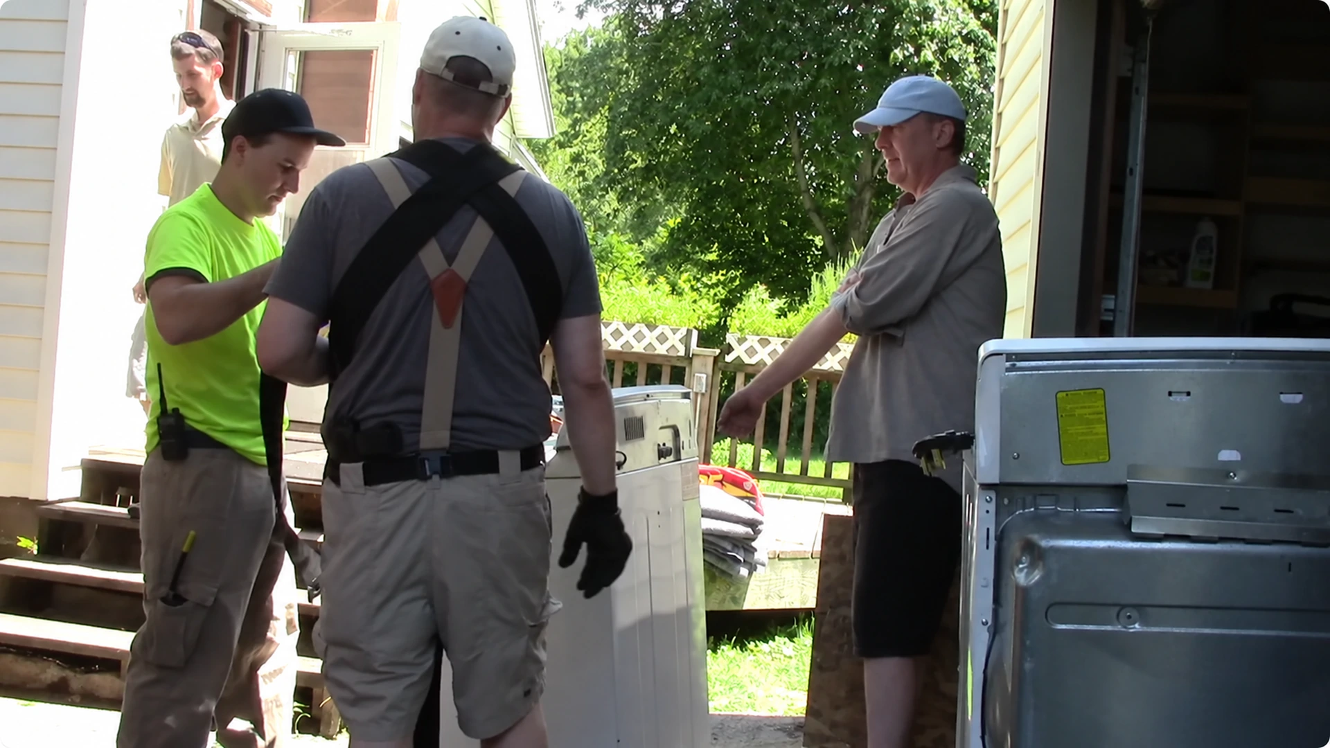Carefully wrapped furniture being moved through a home